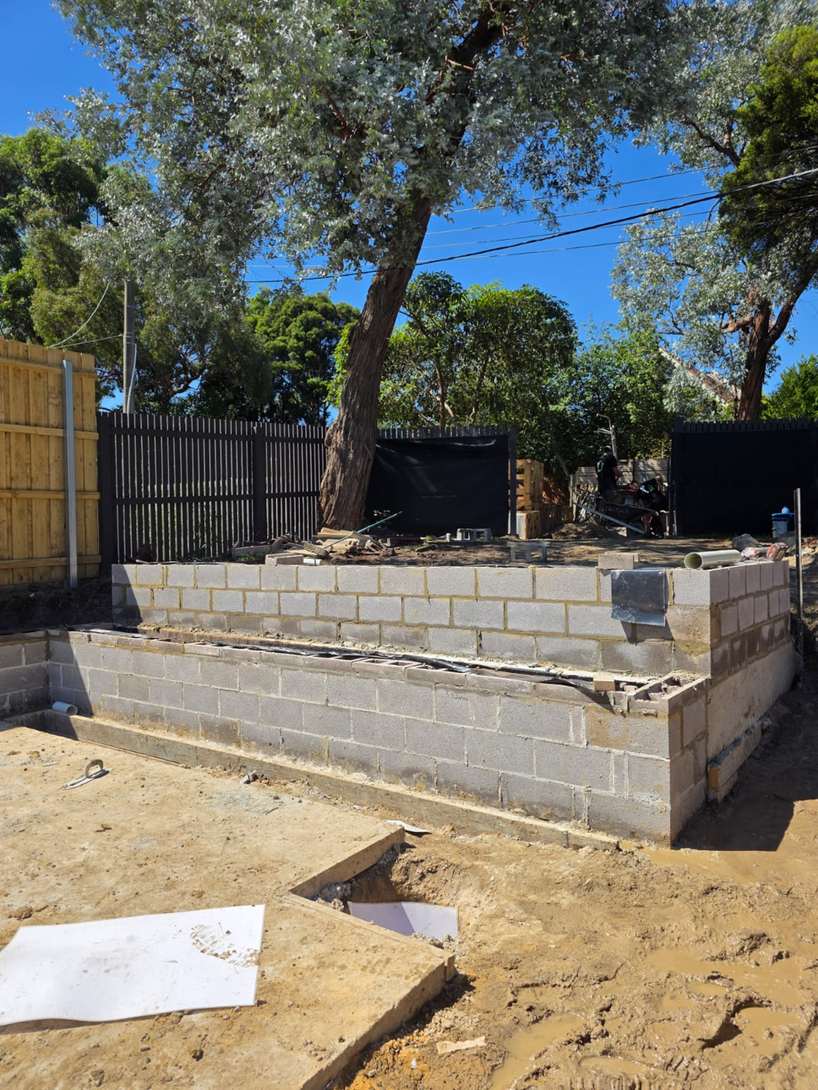 Tiered block retaining wall in a backyard, block retaining walls, Melbourne