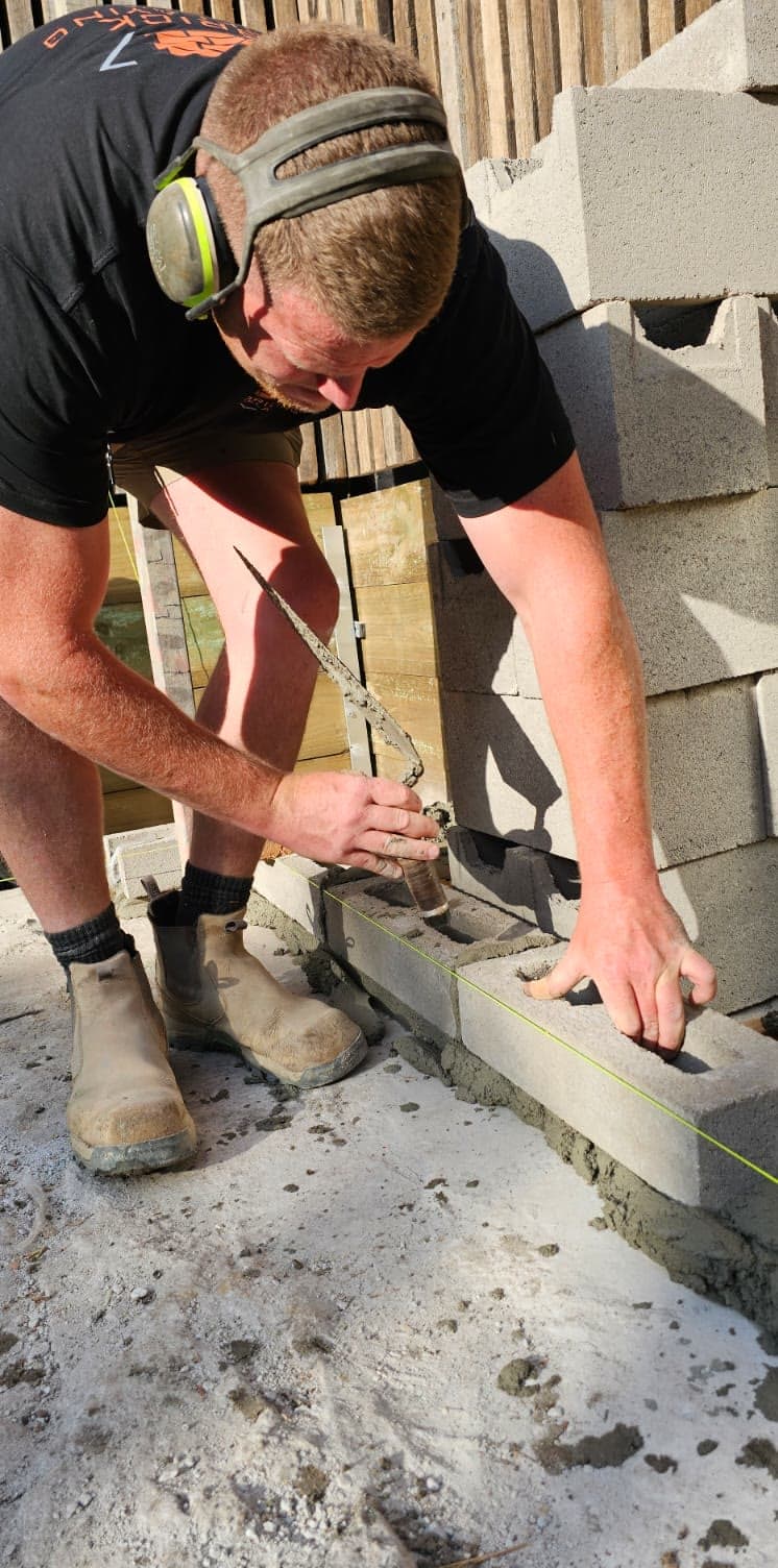core-filled block retaining wall on a sloping site — JC Brick & Blocklaying — bricklayer Melbourne eastern suburbs