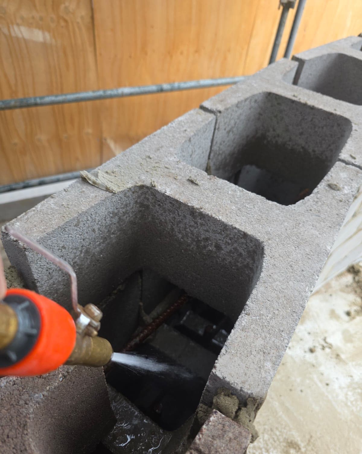 rendered block retaining wall along a driveway — JC Brick & Blocklaying — bricklayer Melbourne eastern suburbs